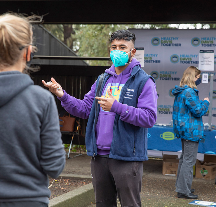 Image of a student helping others around near testing areas