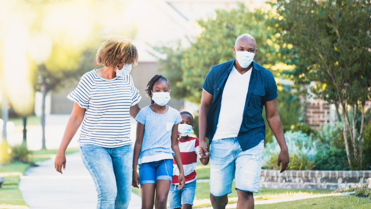 children, adolescents, and parents in masks